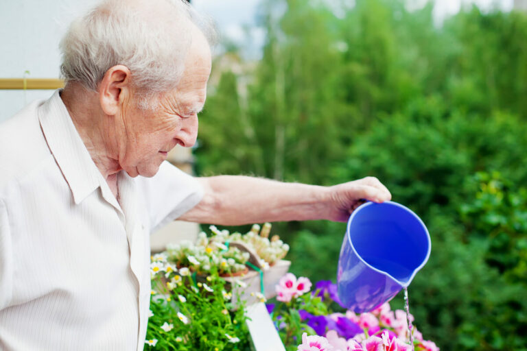 Everlan of Hixson | Senior man watering the flowers