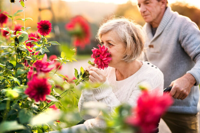 Everlan of Johnson City | Senior woman smelling the flowers